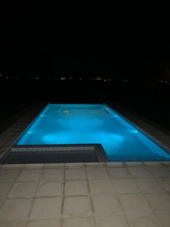 Casa en Venta en La Herradura, Pinamar: Arquitectura Elegante, Balcon con Vista a la Cancha de Polo y Pileta Climatizada